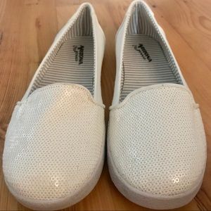 Arizona. White slip ons with sequin toes.